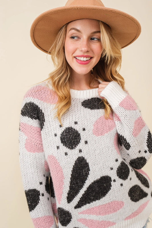 Ink Petal Symphony Sweater - Cozy and chic black and pink floral knit, perfect for embracing floral elegance and warmth in style
