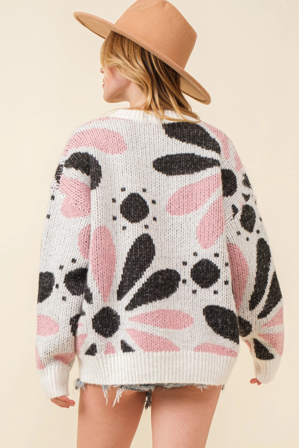 Ink Petal Symphony Sweater - Cozy and chic black and pink floral knit, perfect for embracing floral elegance and warmth in style